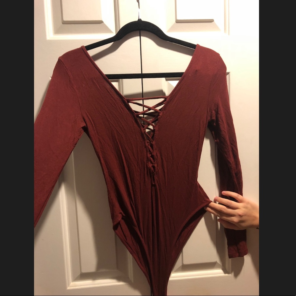 Long sleeve maroon body suit, deep plunge lace up